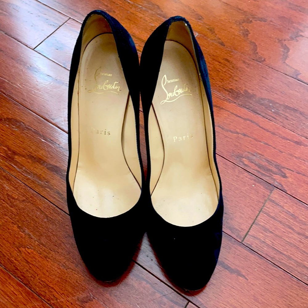 Louboutin black suede pumps. Round toes. Stiletto heels with platform. S…